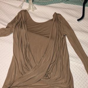 Lulu’s tan backless top.